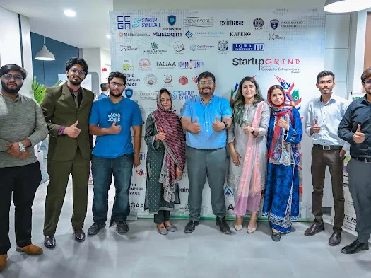 Organisers and guests at the Startup World Cup backdrop