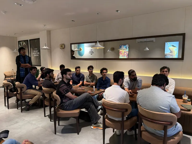 Guests seated with game cards on the tables