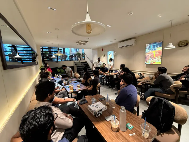 A wide view of the room with guests at every table